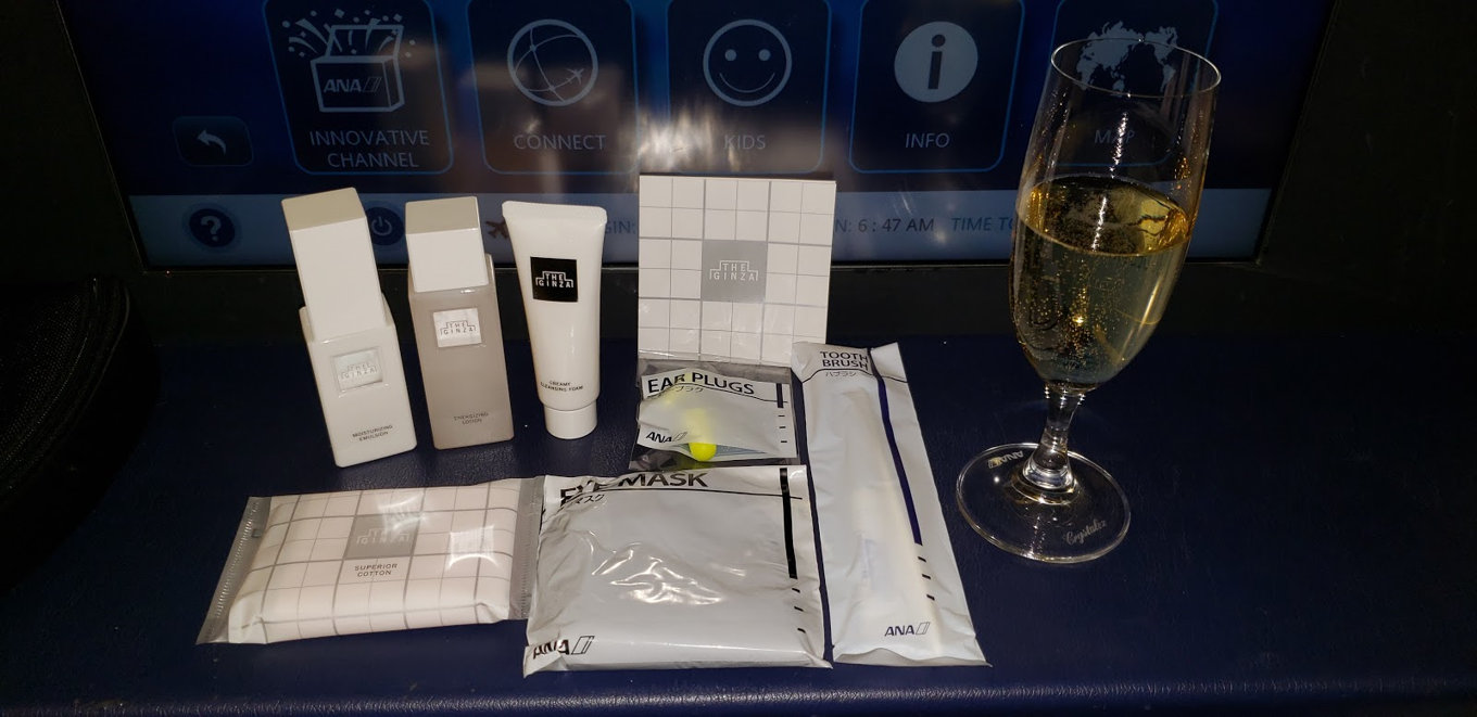ANA First Class amenity kit contents and welcome champagne