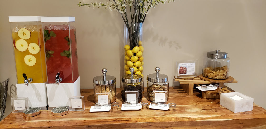 British Airways First Class Lounge juice and cookie table @ JFK airport