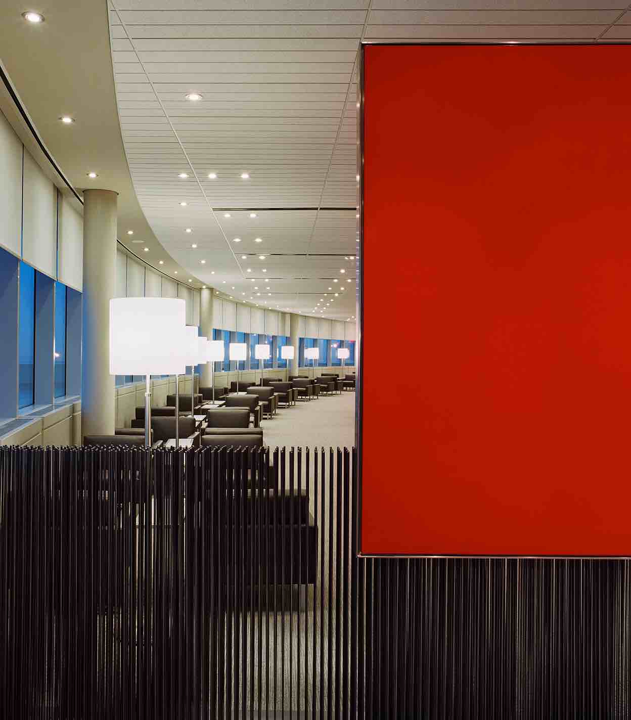 Rows of comfortable armchairs in the Domestic Maple Leaf Lounge in Toronto Pearson.