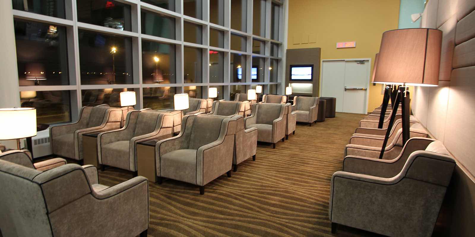 Arm chairs lined up in the Plaza Premium Lounge for U.S. departures in Edmonton